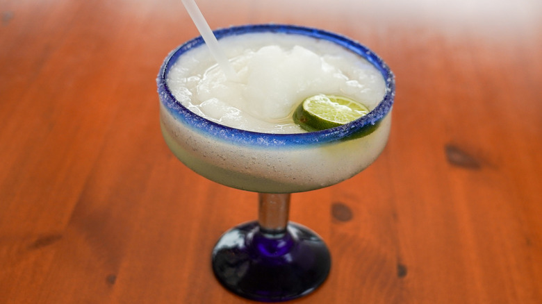 Frozen margaritas on wooden table