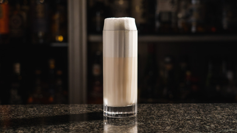 Ramos Gin Fizz on marble countertop at bar
