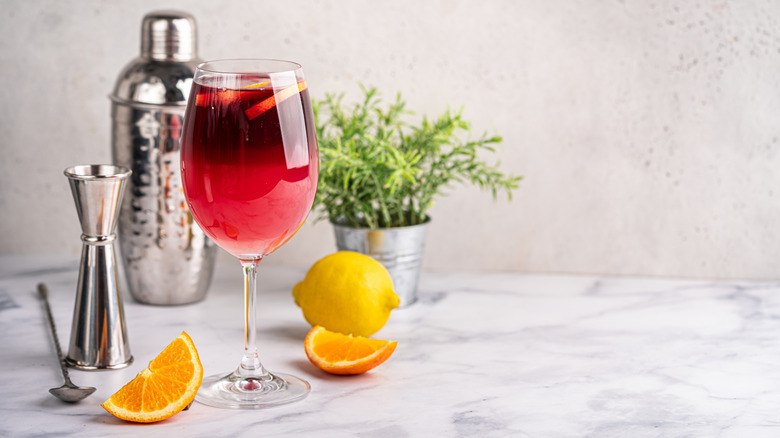 Red wine sangria with bartending tools and ingredients