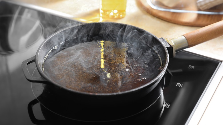 Pan with hot oil on stove