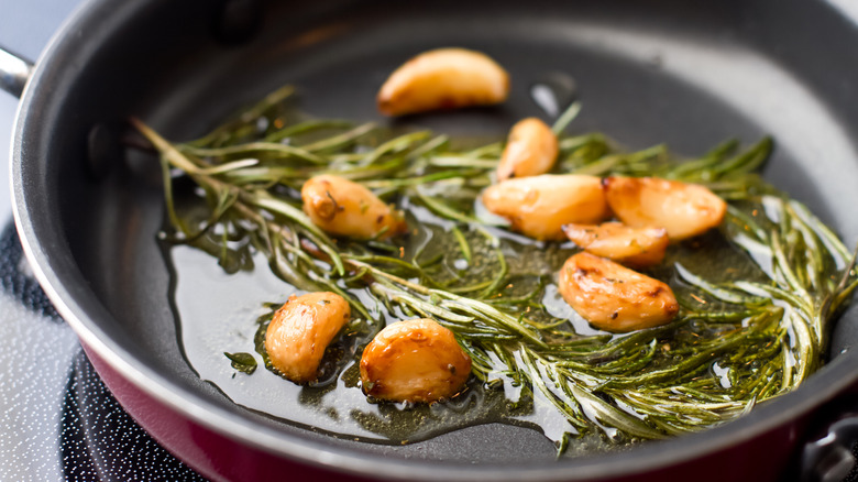 Garlic and rosemary in pan