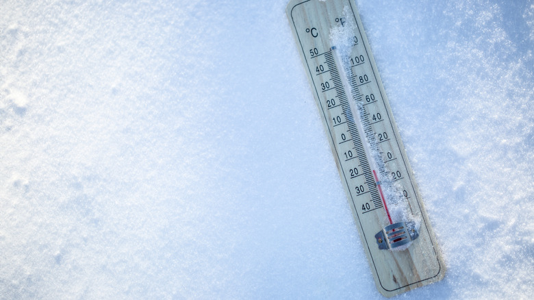 Thermometer on icy surface