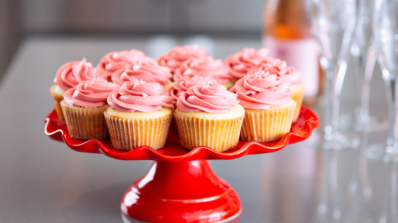 Pink champagne cupcakes on a cake stand