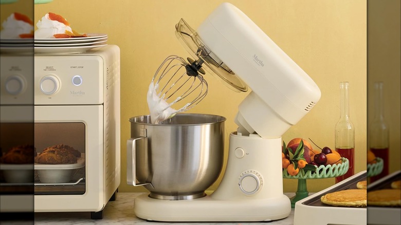 A Martha Stewart tilt-head stand mixer in the linen cream color.