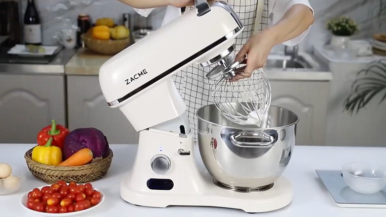 A cream-colored Zacme commercial stand mixer