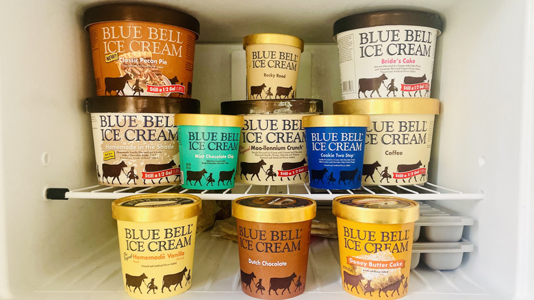 Collection of different Blue Bell Ice Cream flavors inside freezer