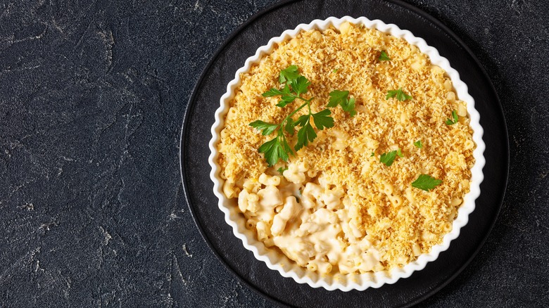 A bowl of mac and cheese with breadcrumbs