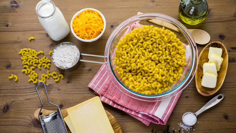 Various ingredients for mac and cheese on a table