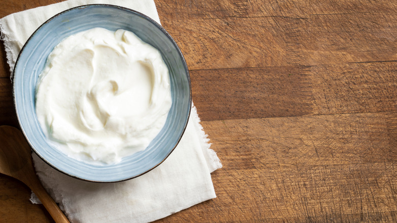 A bowl of Greek yogurt on a table