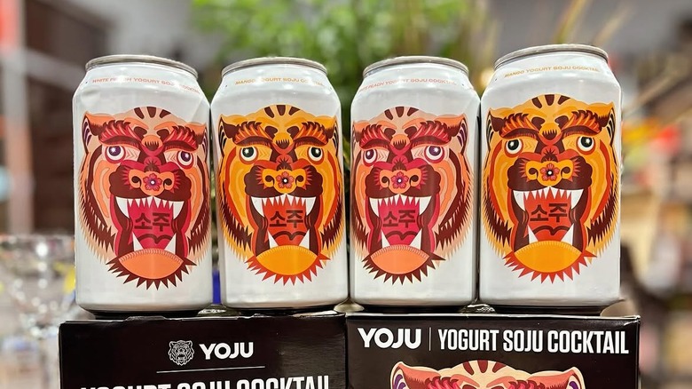 Cans of Yoju sit atop their boxes