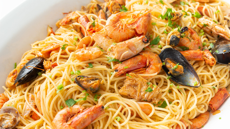 Spaghetti with shellfish, including clams, mussels, and prawns.