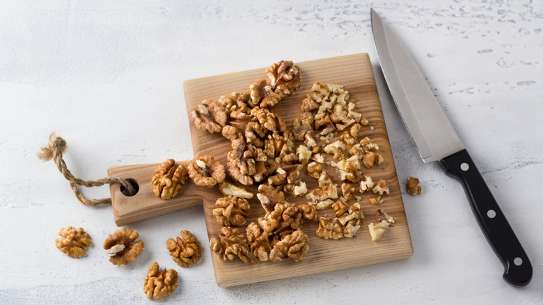 chopped walnuts with chef knife