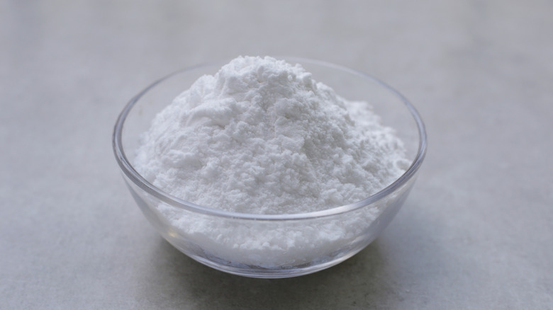 glass bowl of powdered sugar