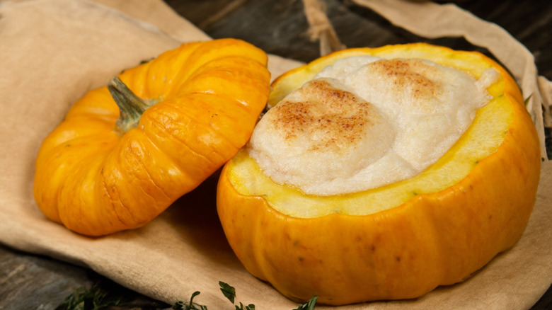 Soufflé baked into a small pumpkin on a brown paper napkin
