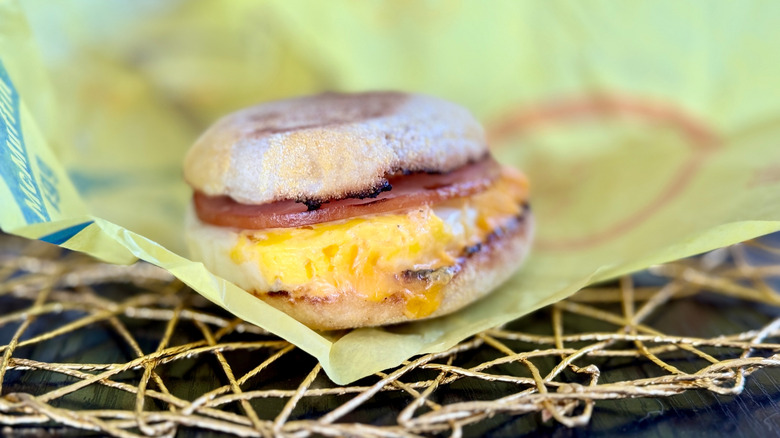 Egg McMuffin sits on yellow wrapping paper