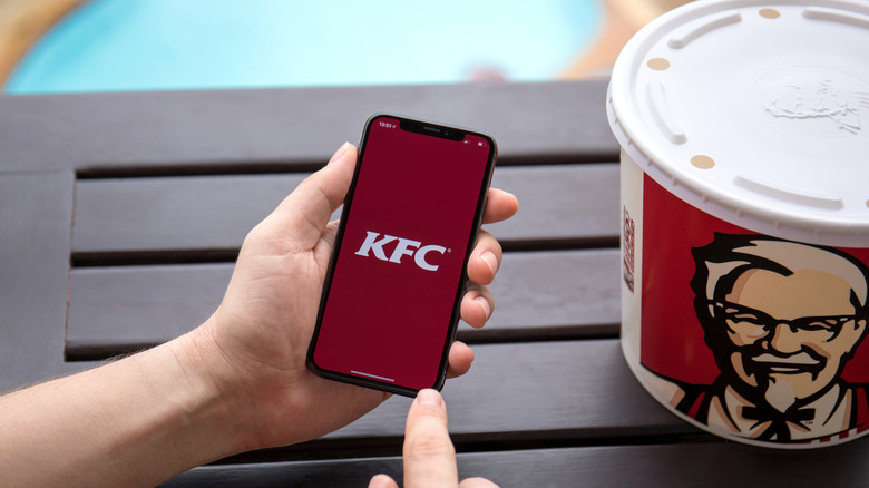 Person using KFC app on phone