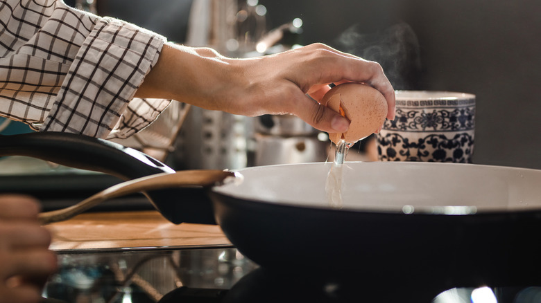 Cracking egg into skillet