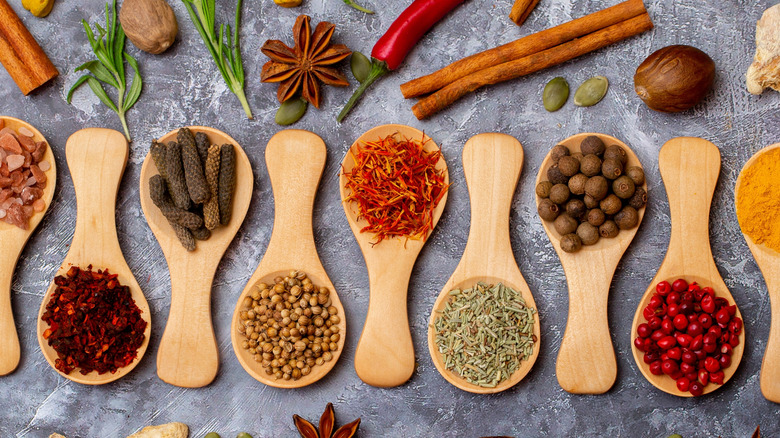 Assortment of spices in wooden spoons