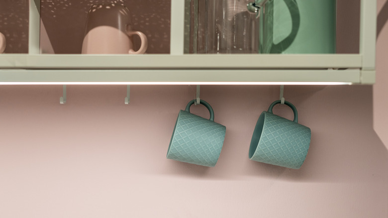 Mugs hanging from hooks