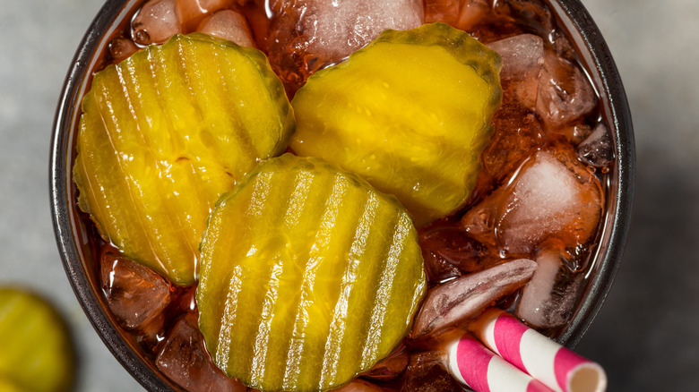 sliced pickle in coca cola