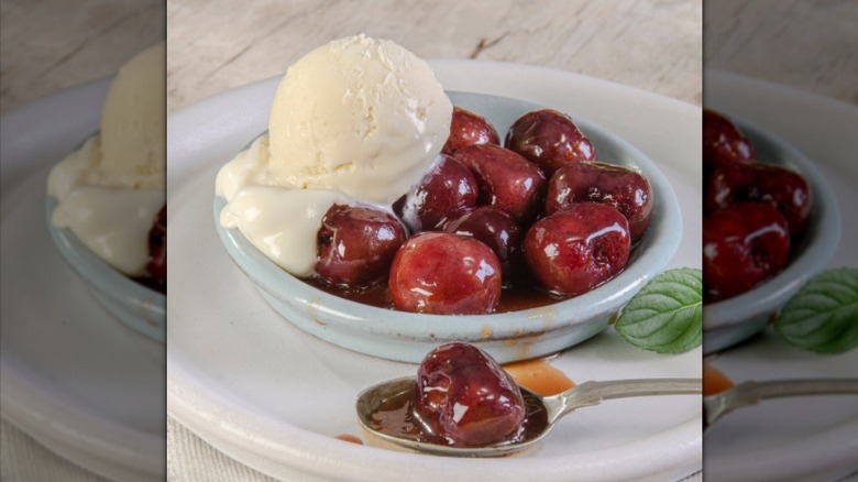 Cherries Jubilee served with ice cream and nuts