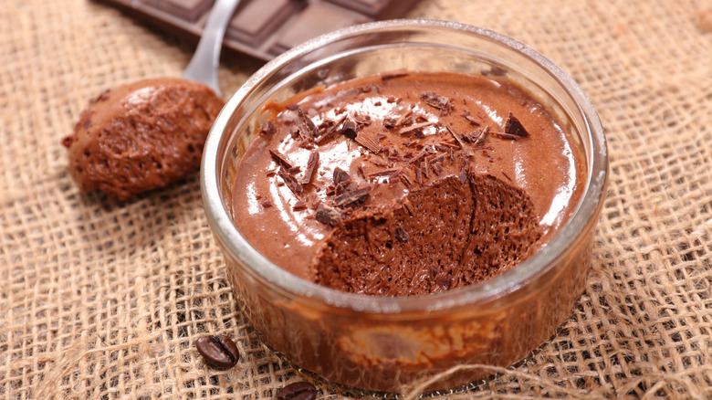 Chocolate Mousse in a clear bowl with a spoonful removed