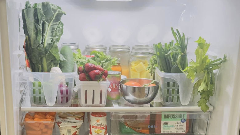 Produce storage containers in refrigerator