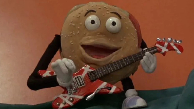Hamburger from Better Off Dead playing guitar