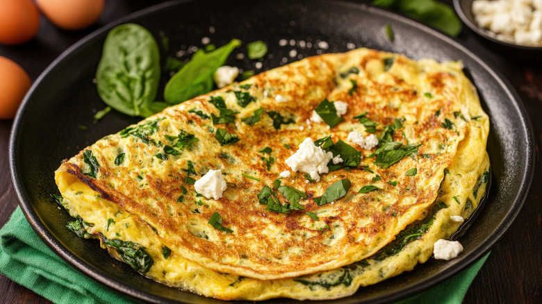 duck egg omelet in a pan with cheese
