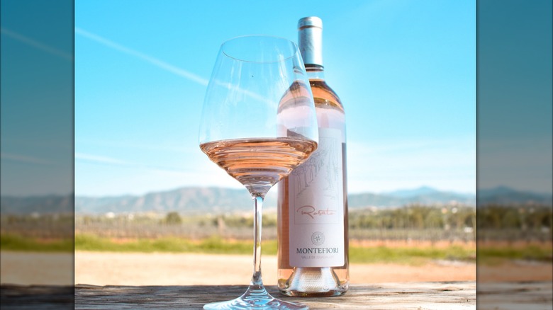 A bottle and glass of Montefiori Rosato on a table