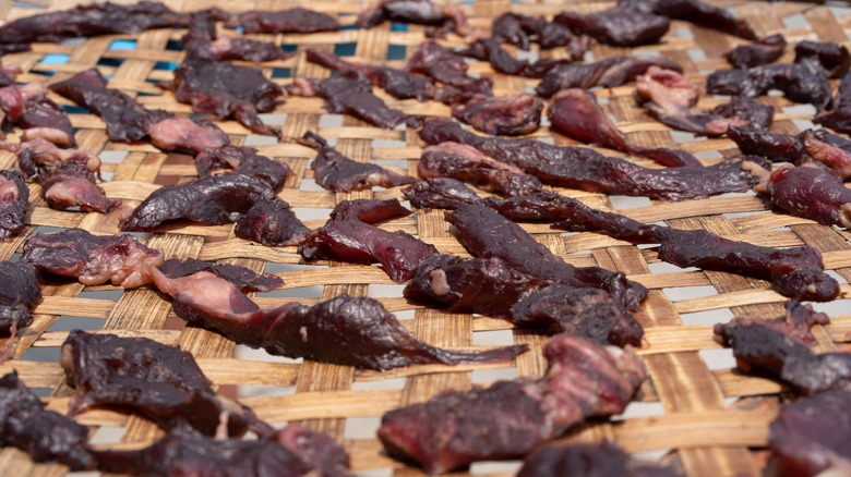 Raw beef jerky in the process of drying