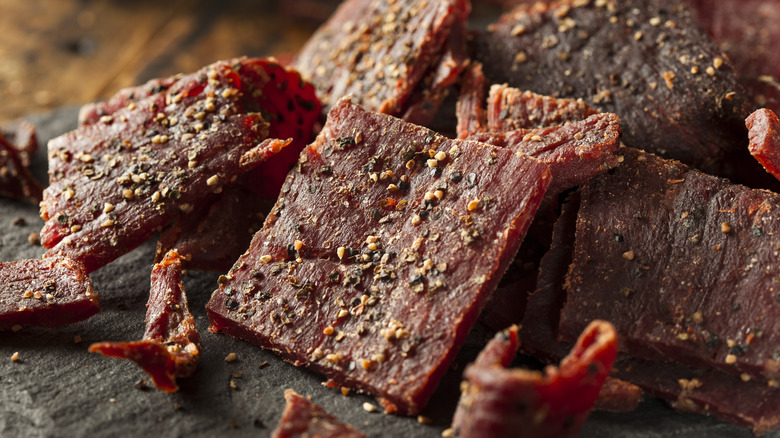 A close-up of seasoned beef jerky pieces