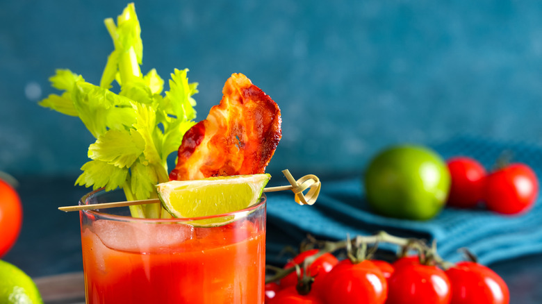 A bloody Mary is garnished with bacon