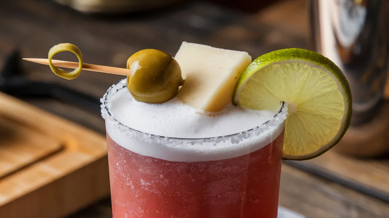 An olive joins bloody Mary garnishes.