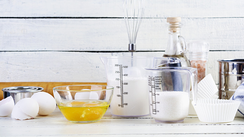 Measuring cups and baking ingredients