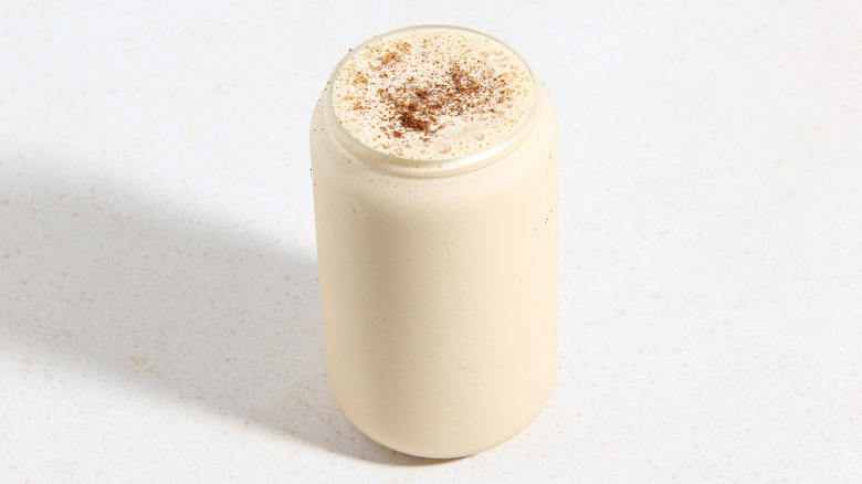 Vanilla milkshake with chocolate powder on top