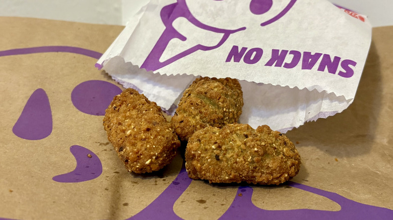 Three stuffed jalapeños on a Jack in the Box bag