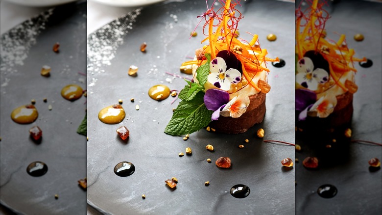 Chocolate cake dish at a restaurant with elaborate garnish