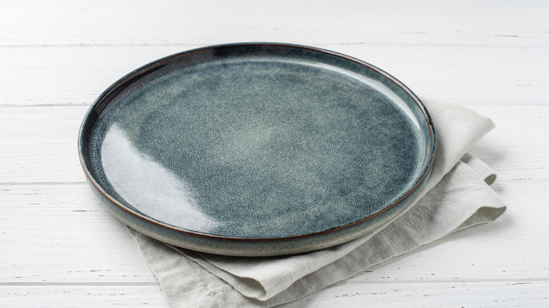 Blue stoneware plate on a table