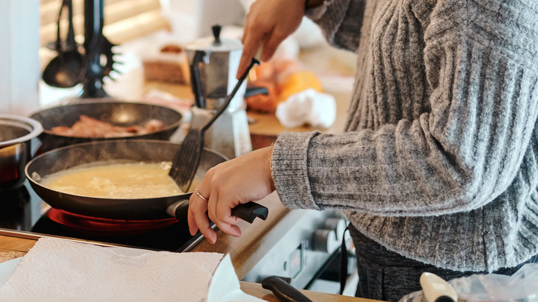 Woman stirring eggs