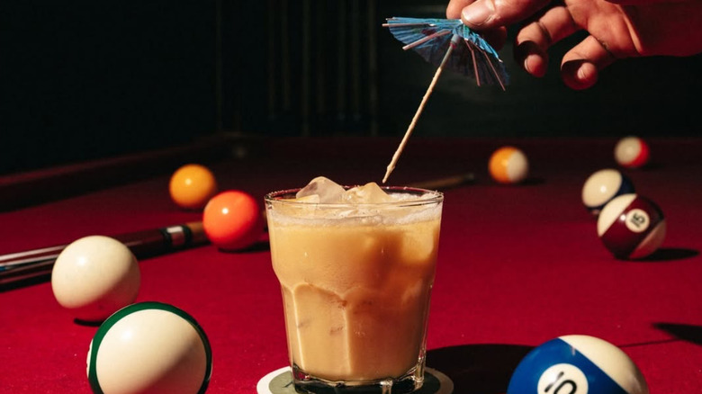 A cocktail and pool table at Martha My Dear