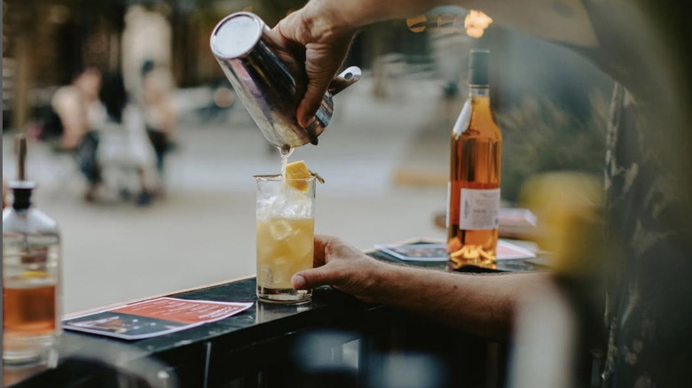 A bartender making a cocktail at Sidebar