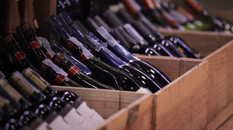 Bbottles of wine placed within wooden crates