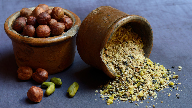 Crockware pots of dukkah and hazelnuts