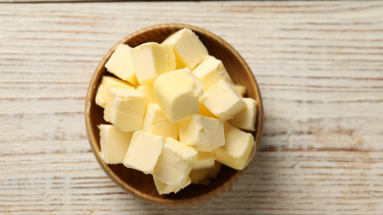 Cubed butter in a wooden bowl