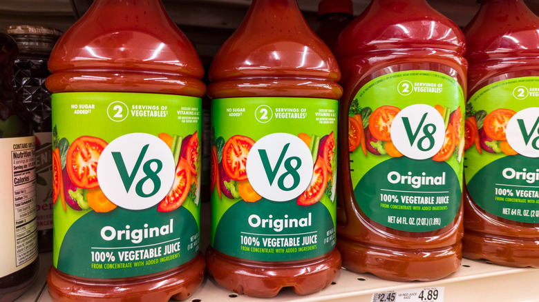Jars of V8 on a grocery shelf