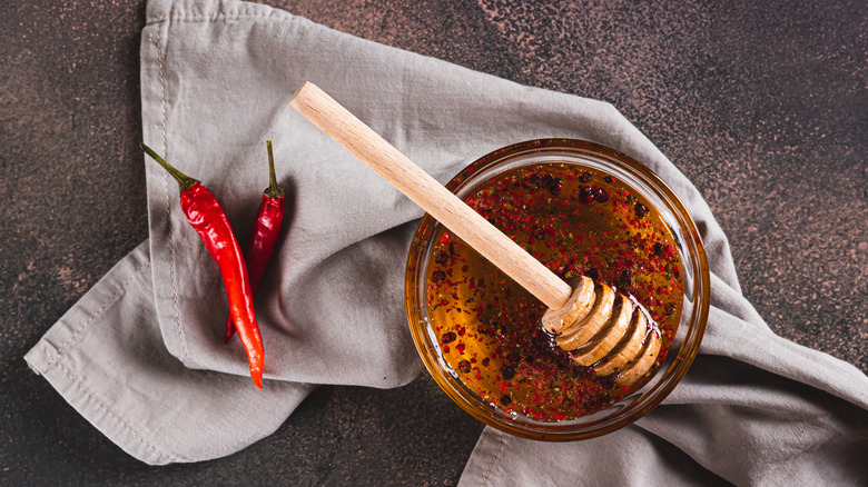 Bowl of hot honey with chili peppers