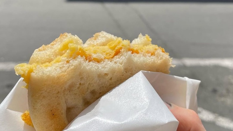 A half-eaten 5 e 5 sandwich