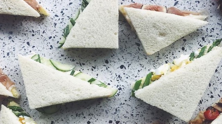 Tramezzino sandwiches on a speckled counter