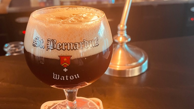 A goblet of St.Bernardus ale sits on a table.